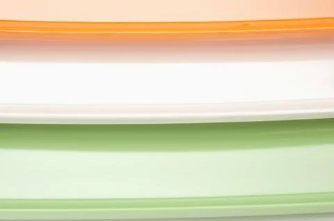 Close-up of a stack of colorful trays representing Indian flag colors Stockfoto's