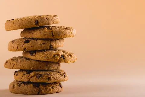 Close-up of stack of cookies against brown background with copy space Foto stock