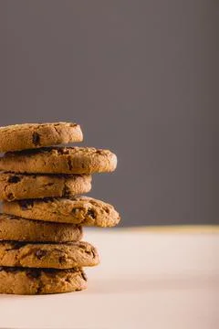 Close-up of stack of cookies against gray background with copy space Foto stock