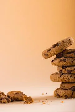 Close-up of stack of cookies on brown background with copy space 스톡 사진