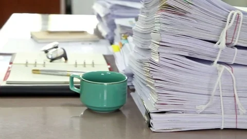 Close up on stack of documents on desk in office Stock Footage 76492464