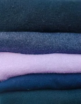 Close up of Stack folded sweater clothing Stock Photos