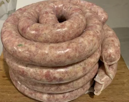 Close-up of a stack of fresh pork sausages cooked in the home kitchen Stock Photos