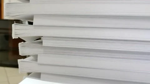 Close-up of a stack of glued book blocks prepared for binding in a printing hous Stock Footage 311166491