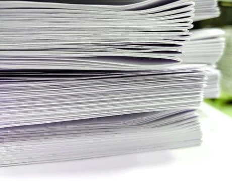 Close-up, a stack of glued book blocks prepared for binding in a printing hou Stock Photos