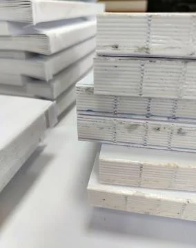 Close-up, a stack of glued book blocks prepared for binding in a printing h.. 写真素材