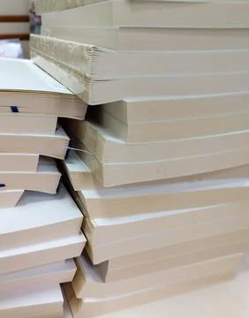 Close-up, a stack of glued book blocks prepared for binding in a printing h.. Stock Photos