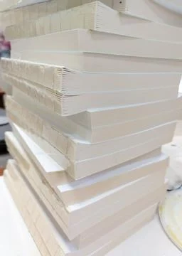Close-up, a stack of glued book blocks prepared for binding in a printing h.. Stock Photos