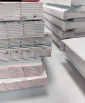 Close-up, a stack of glued book blocks prepared for binding in a printing h.. Stock Photos