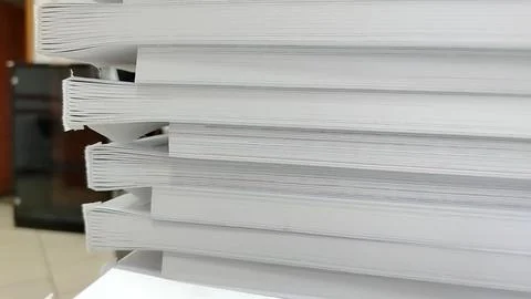 Close-up of a stack of glued book blocks prepared for binding in a printing h 写真素材