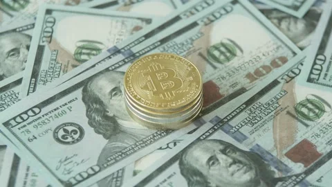 Close-up of a stack of Gold Coins with the bitcoin symbol lies on a table Stock Footage 221646012