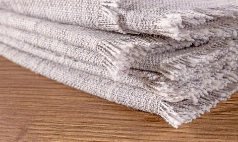 Close-up of a stack of gray linen kitchen napkins for household and dining us Stock Photos