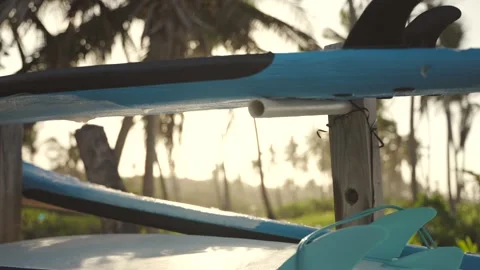 Close-up of a stack of large surfboards for the beginners on a board rack  Stock Footage 244592010