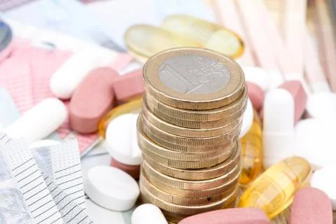 Close up of a stack of money with capsules in the background Foto stock