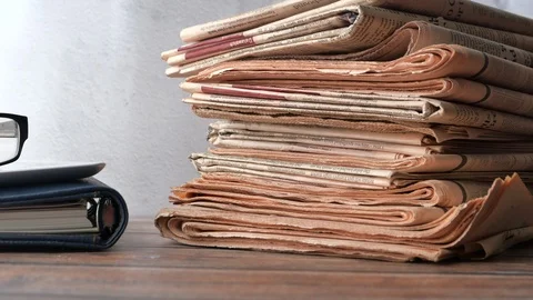 Close up of stack of newspaper on table Stock Footage 124062118