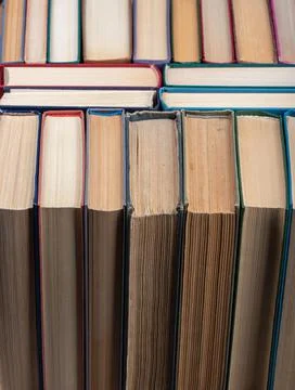 Close-up of a stack of old paper books. Stock Photos