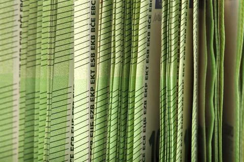 Close-up of a stack of paper bills, side view. Euro banknotes stacked on top of Stock Photos