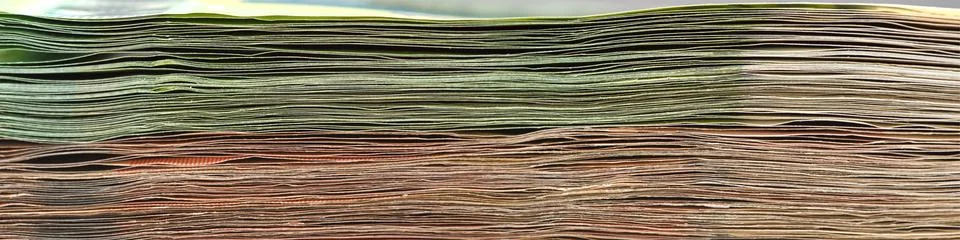 Close-up of a stack of paper bills, side view. Euro banknotes stacked on top of Stock Photos