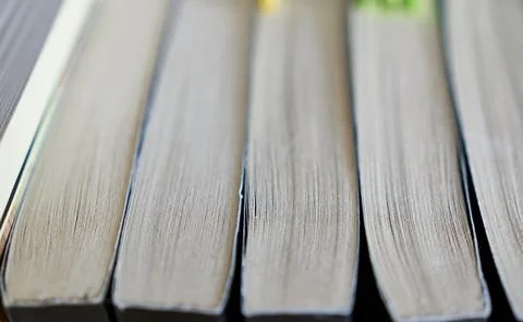 Close-up of a stack of paperback books, shallow depth of field Stock Photos