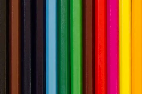 Close up of a stack of pencil crayons vertical Stock Photos