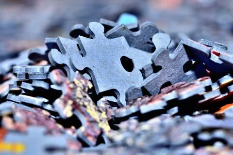 Close-up of stack of puzzle pieces. Blue color. Stock Photos