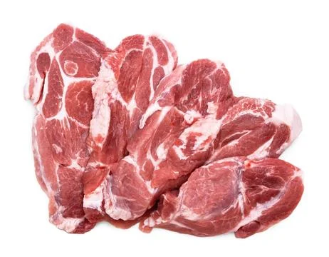A close-up of a stack of raw pork neck steaks (collar chops), showing beaut.. Stock-Fotos