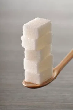 Close-up of Stack of Sugar Cubes on Spoon Stockfoto's
