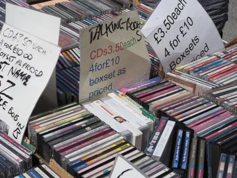 Close up of a stack of various compact discs, cds for sale on a stall Stock Photos