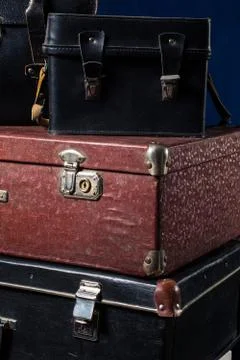Close-up of a stack vintage shabby suitcases Stock Photos