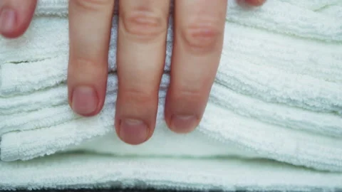 Close-up of stack of white cotton terry clean folded towels. Stock Footage 144832987