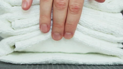 Close-up of stack of white cotton terry clean folded towels. Stock Footage 145454370