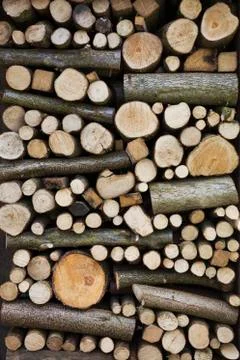 Close up of a stack of wooden logs and twigs, a log store. 스톡 사진