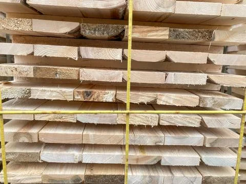 Close-up stack of wooden planks stacked in one place for construction, wood.. Stock Photos
