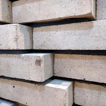 Close-up of stacked beige construction tiles Stock Photos