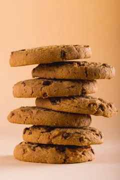 Close-up of stacked cookies against brown background, copy space Stock Photos