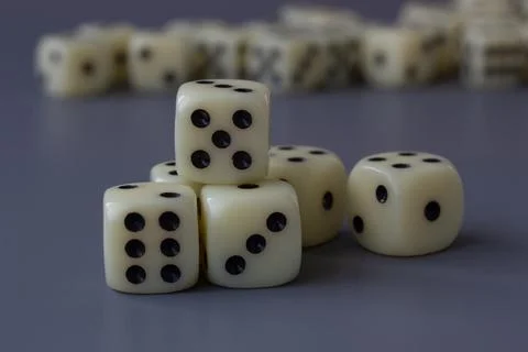 Close-up Of Stacked Dice With Blurred Background Stock Photos