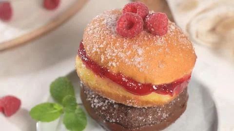 Close-up of Stacked Filled Donuts with Raspberry Jam and Chocolate Topped w.. Stock Photos