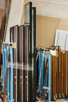 Close-up of stacked metal window frames in workshop Foto stock