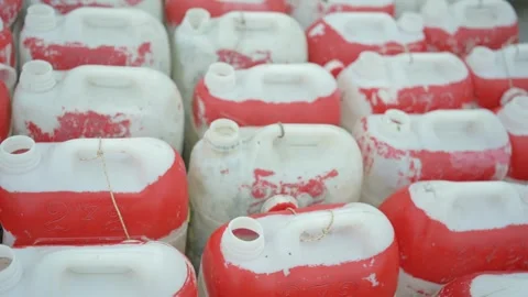 Close up of stacked plastic containers with worn red paint Stock Footage 341104241