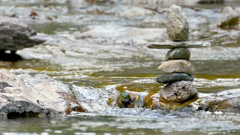 Close-up of stacked stones with a blurred background in a mountain stream. Stock Footage 308376035