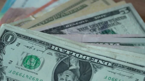 Close Up Of Stacked United States Dollar Bills On Table Stock Footage 339978183