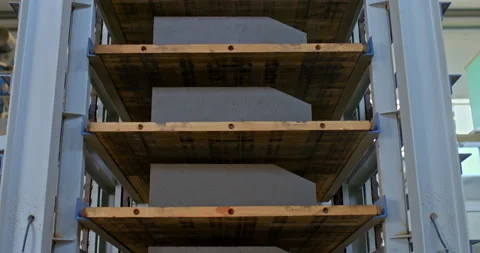 Close-up, a stacker loaded with concrete parts. Automated modern stacker in the Stock Footage 158405364