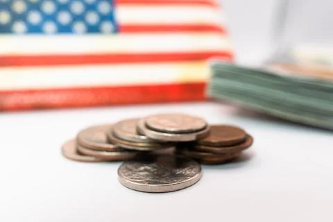 Close up of stacking coins against the backdrop of the American flag, USA one Stock Photos
