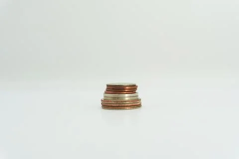 Close up of stacking coins on white background, USA one cent, Money growing Stock Photos