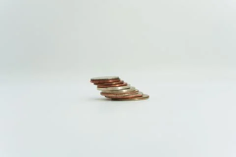 Close up of stacking coins on white background, USA one cent, Money growing Stock Photos