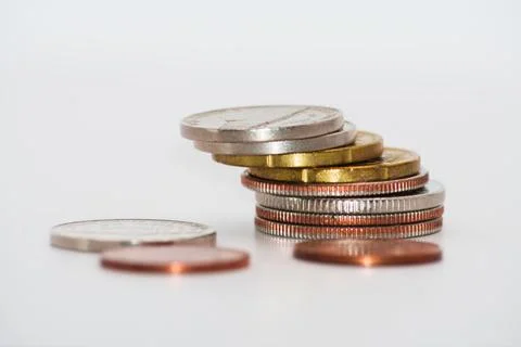 Close up of stacking coins on white background, USA one cent, Money growing Stock Photos