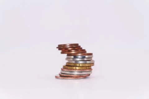 Close up of stacking coins on white background, USA one cent, Money growing Stock Photos