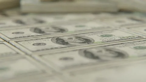 Close up of stacks upon stacks of one hundred dollars Stock Footage 253600807