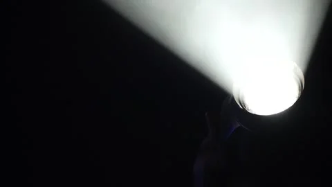 Close-up of stage spotlight emitting blue beam then turning off Stock Footage 346359738