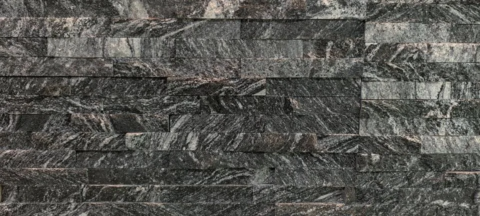 Close‑up of staggered rectangular stone tiles Foto stock